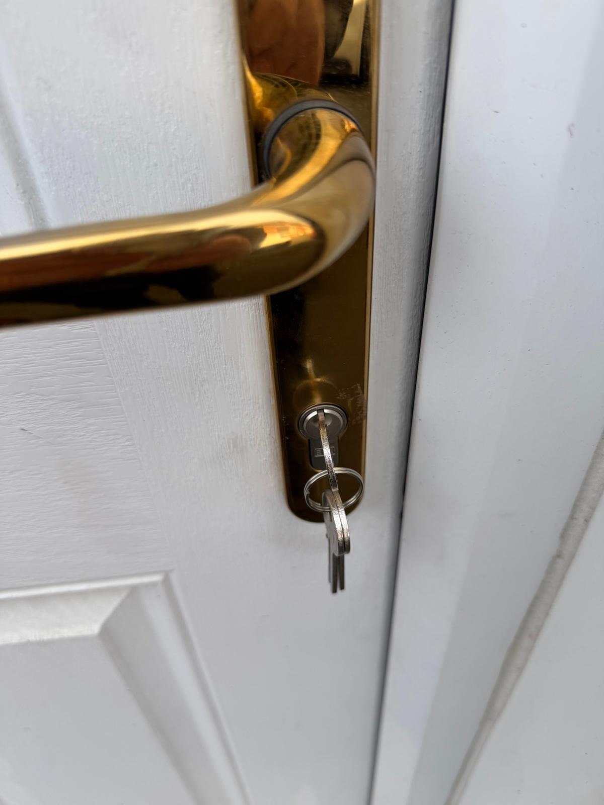 Brass lever handle with new anti-snap euro cylinder fitted to a composite front door