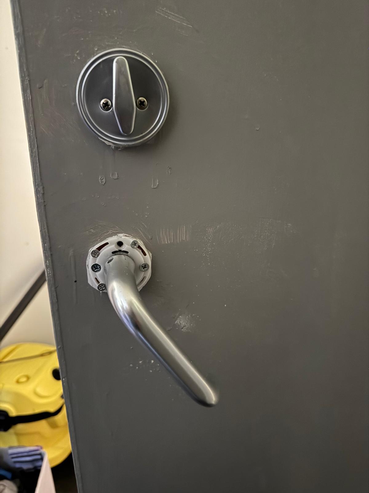 Bathroom thumb-turn privacy lock and matching lever handle installed by locksmith